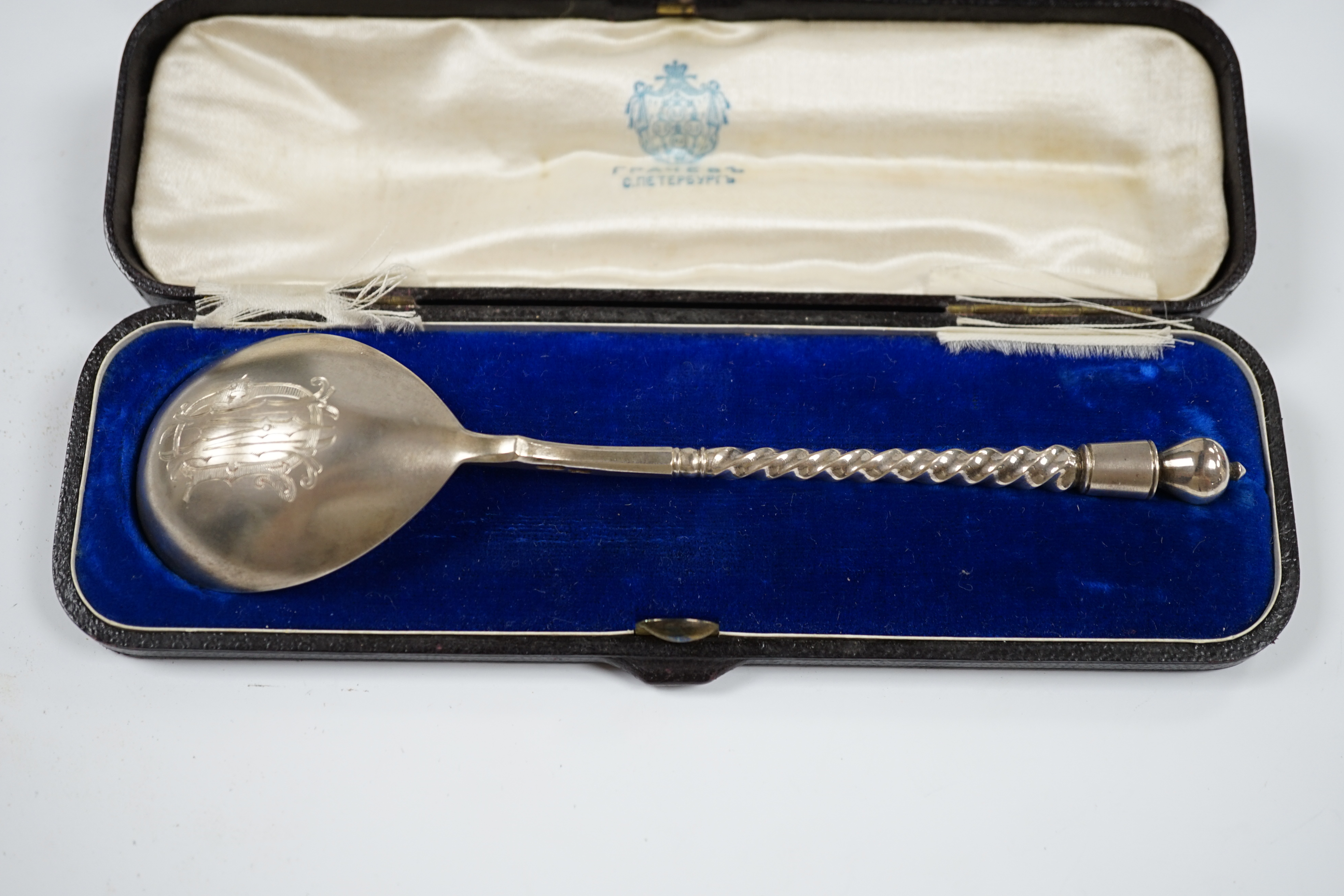 A cased Russian 84 zolotnik spoon, 16.8cm and a cased Victorian silver dessert spoon, London, 1893. Condition - fair to good